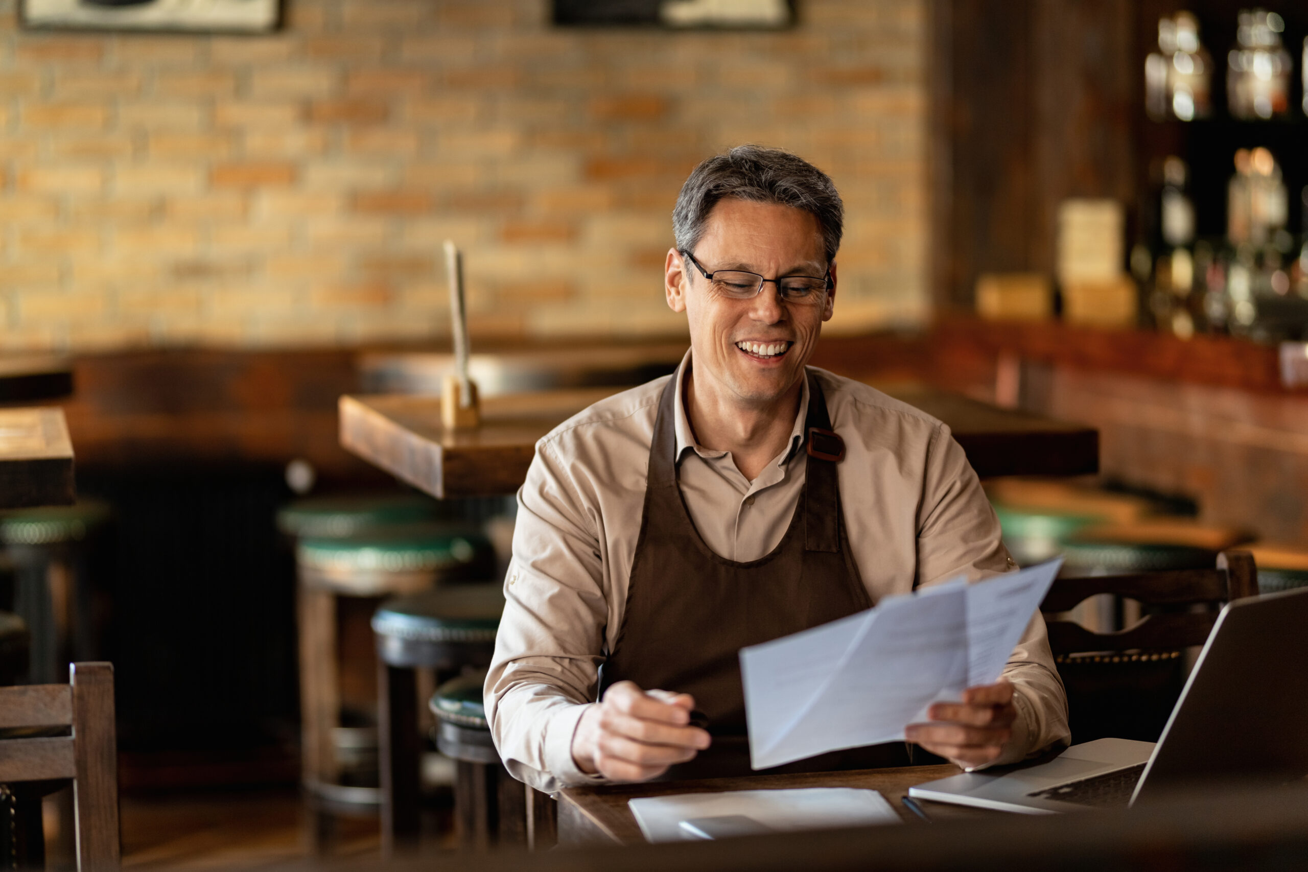 A restaurant manager reviewing financial projections and validating menu engineering profitability gains.